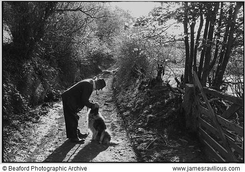 Archie Parkhouse with his dog Sally, Millhams, Dolton, Devon, England, 1982