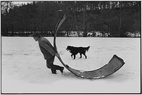 Alf Pugsley moving a shed in case of flood, Langham, Dolton, Devon, England, 1978